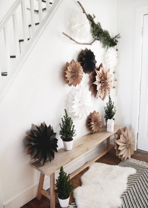 hallway with wood bench with paper stars hanging above it