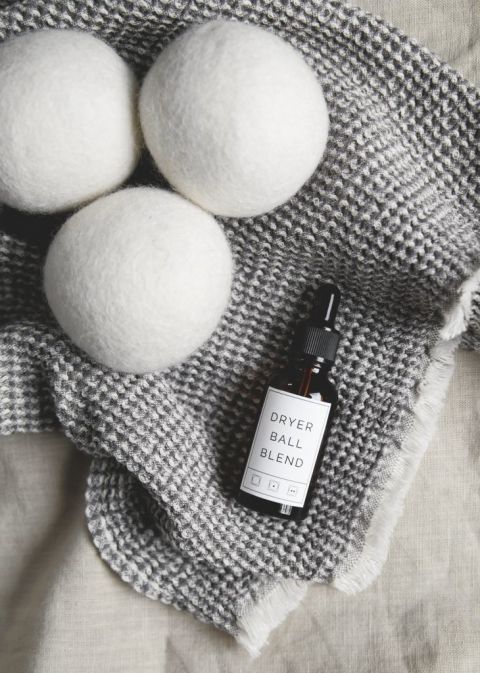 wool dryer balls with bottle of dryer ball essential oil blends
