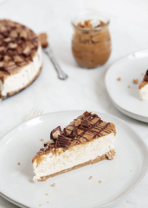 slice of no bake peanut butter cheesecake on a white plate