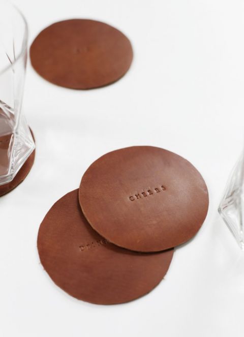 leather stamped coasters with rocks glasses