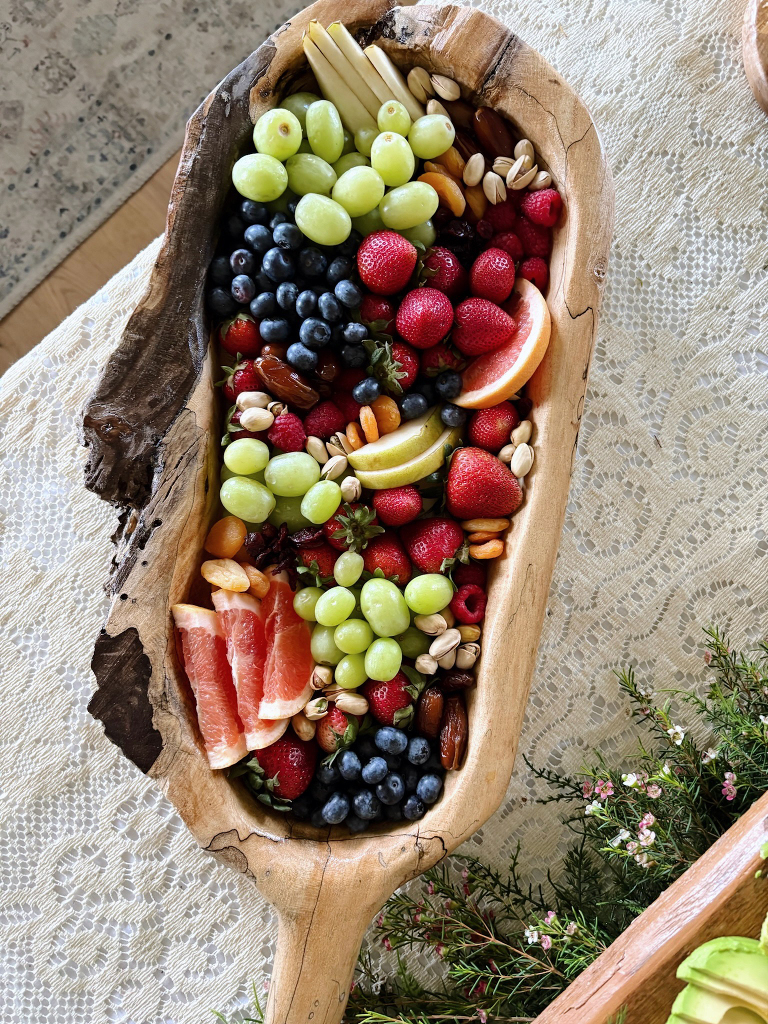 fruit platter on rustic wood serving board