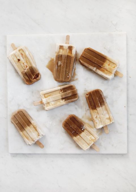 seven coffee popsicles on marble slab