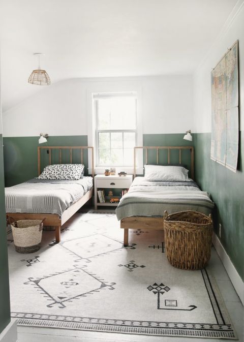 two twin beds in green and white kids room