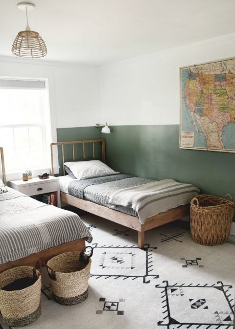 twin bed with in green and white shared kids room
