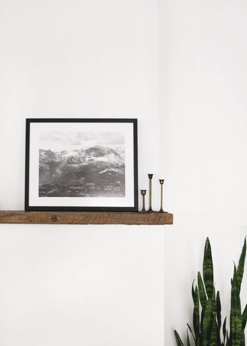 wood mantle with black and white picture