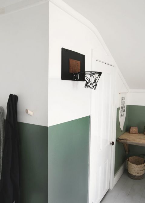 black basketball hoop hanging on wall in bedroom