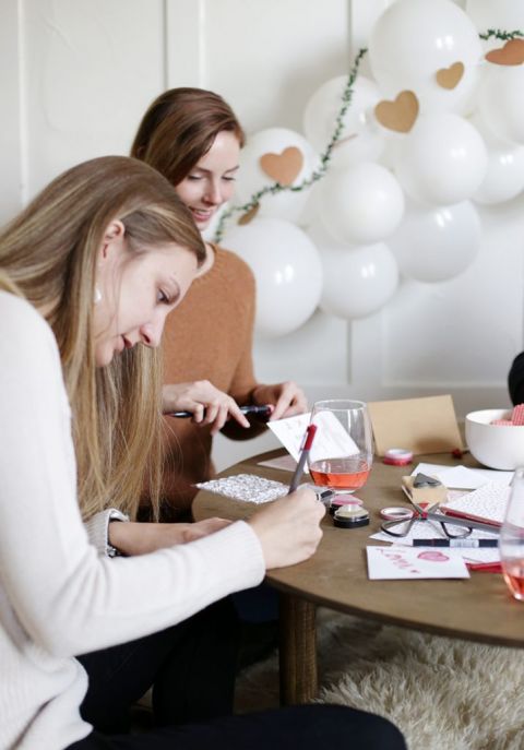 girl writing a valentine