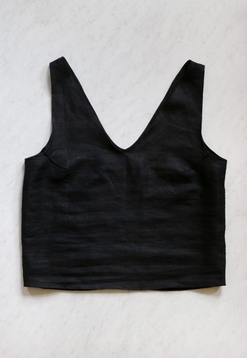 black linen tank laying on floor
