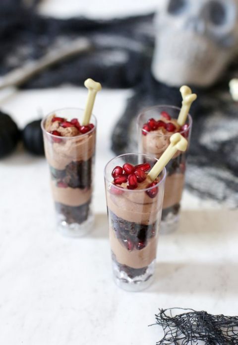 dessert shooters surrounded by halloween decor