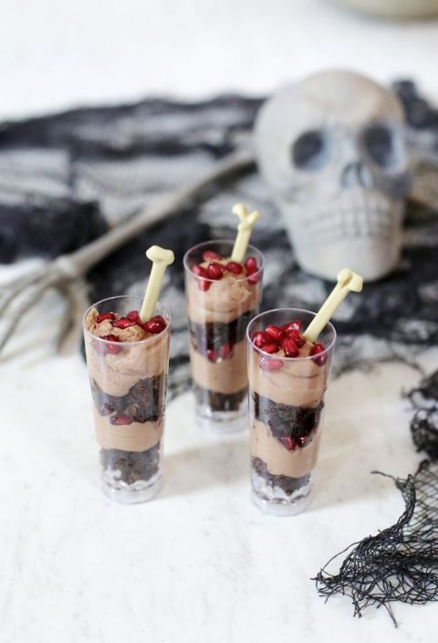 dessert shooters surrounded by halloween decor