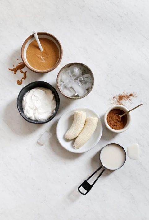 smoothie ingredients laid out on marble counter