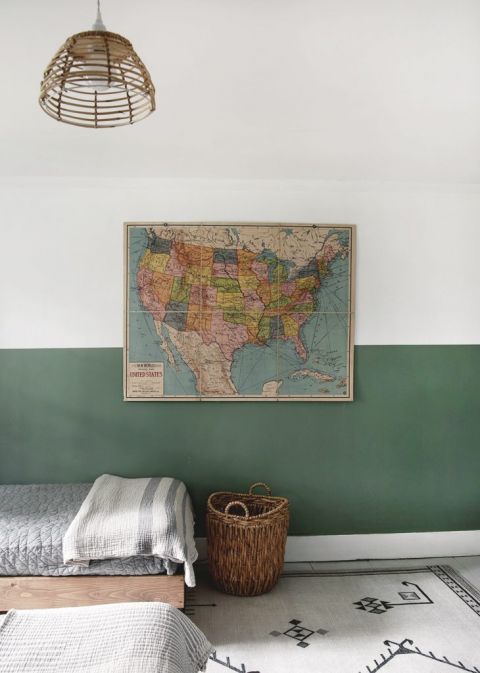 wall painted half green with vintage U.S. map hanging on it