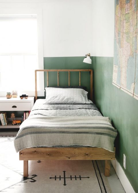 wood dowel headboard bed in green and white kids room