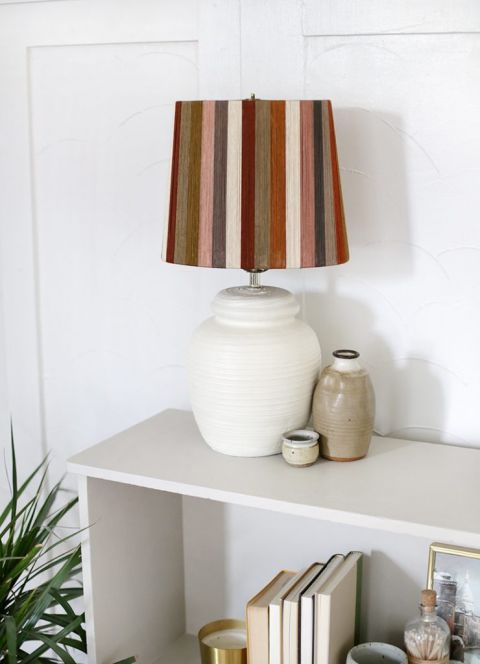 close up of lamp with striped string lampshade