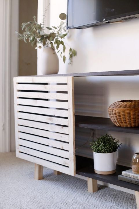 close up of slatted door and decor on console table