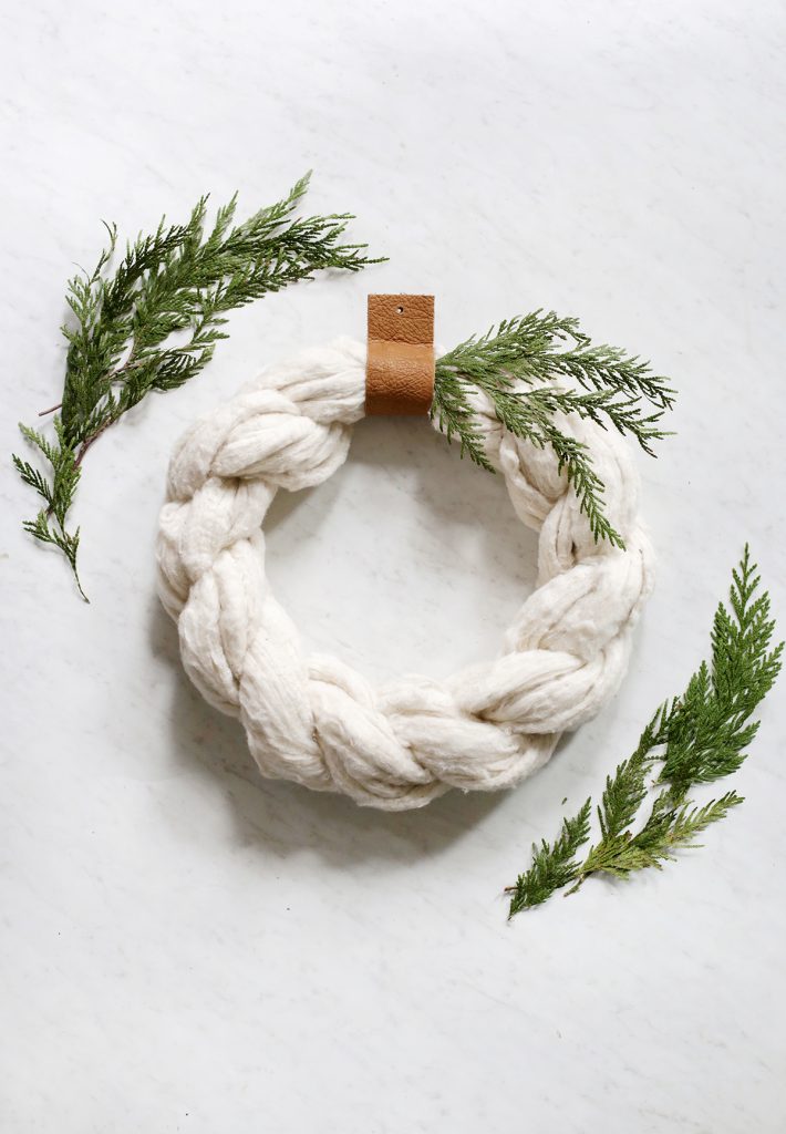 close up of cotton wreath and greens