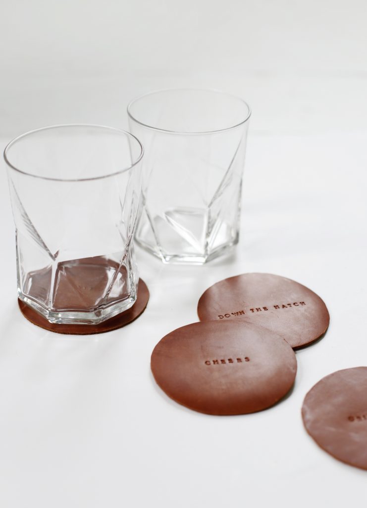 leather stamped coasters with rocks glasses