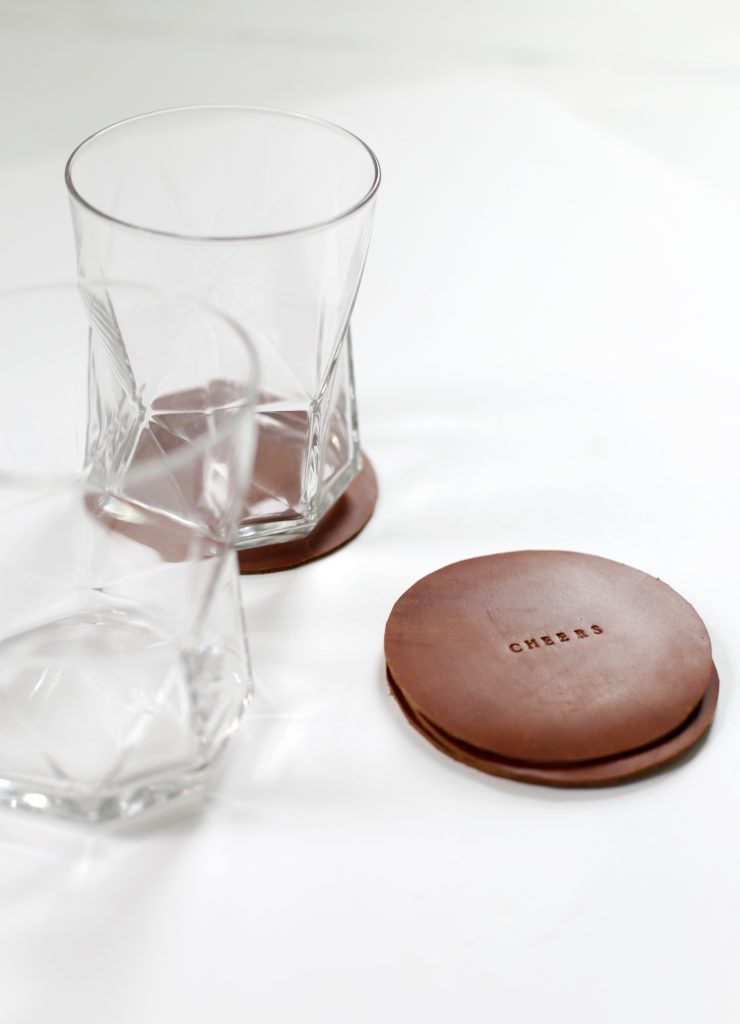 leather stamped coasters with rocks glasses