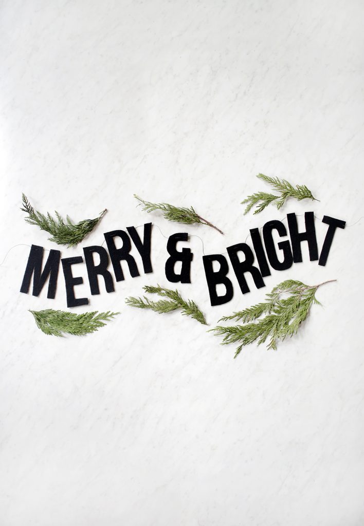 merry and bright garland with greenery