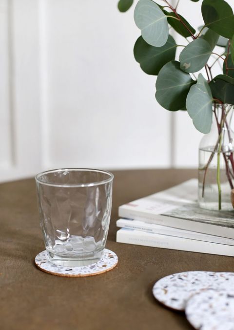 simple table set up with eucalyptus and terrazzo coasters