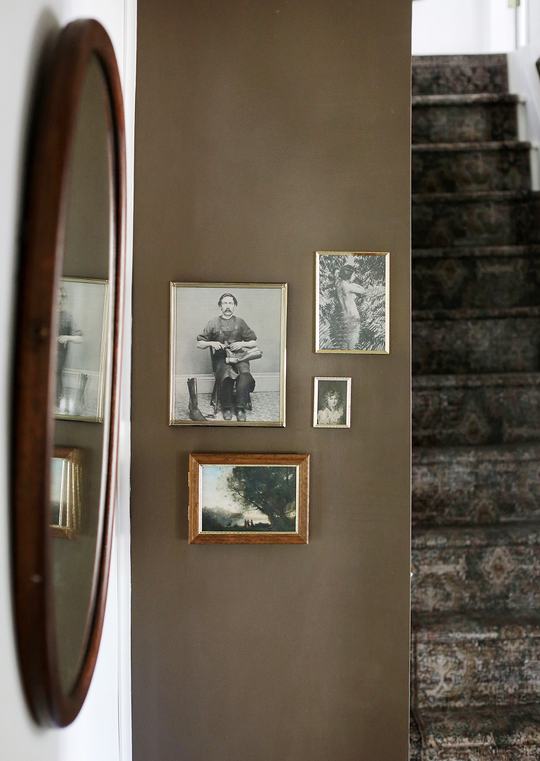 brown wall with vintage frame gallery wall