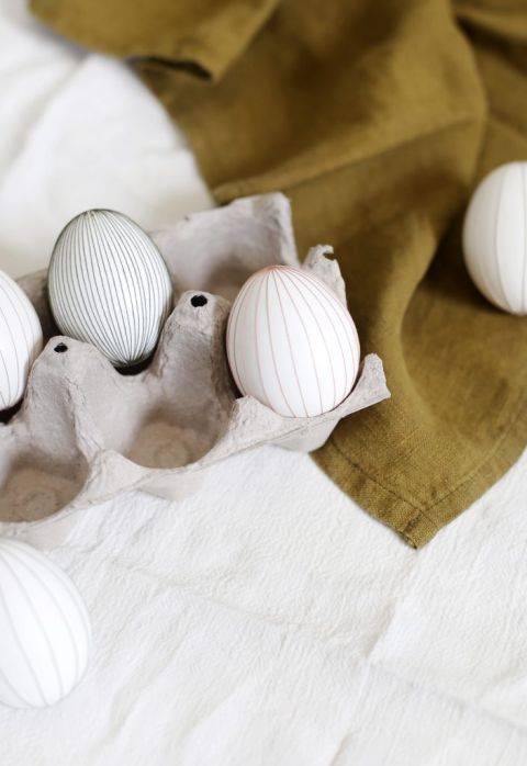 close up of paper egg carton with eggs in it