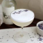 coupe glass with egg white lavender gin sour