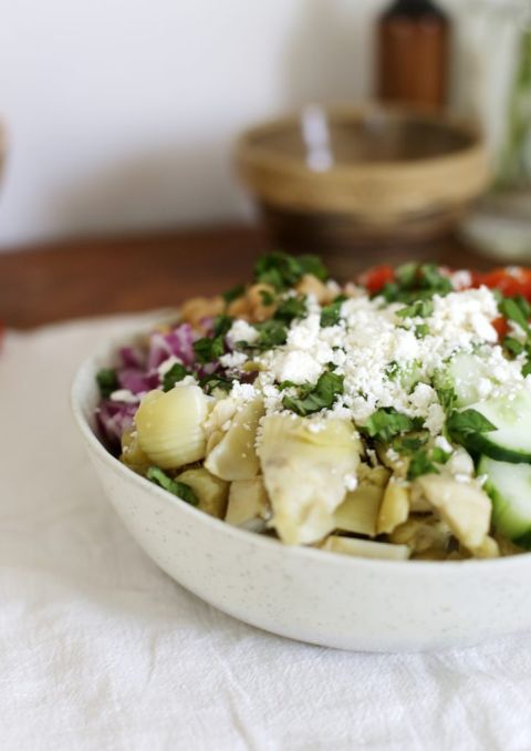 close up of greek artichoke salad in bowl