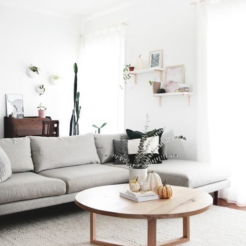 gray couch with round coffee table