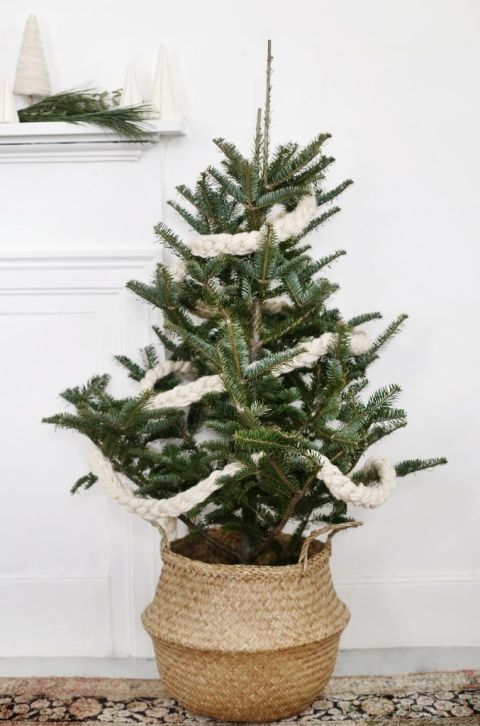 hand crochet garland on mini christmas tree in basket