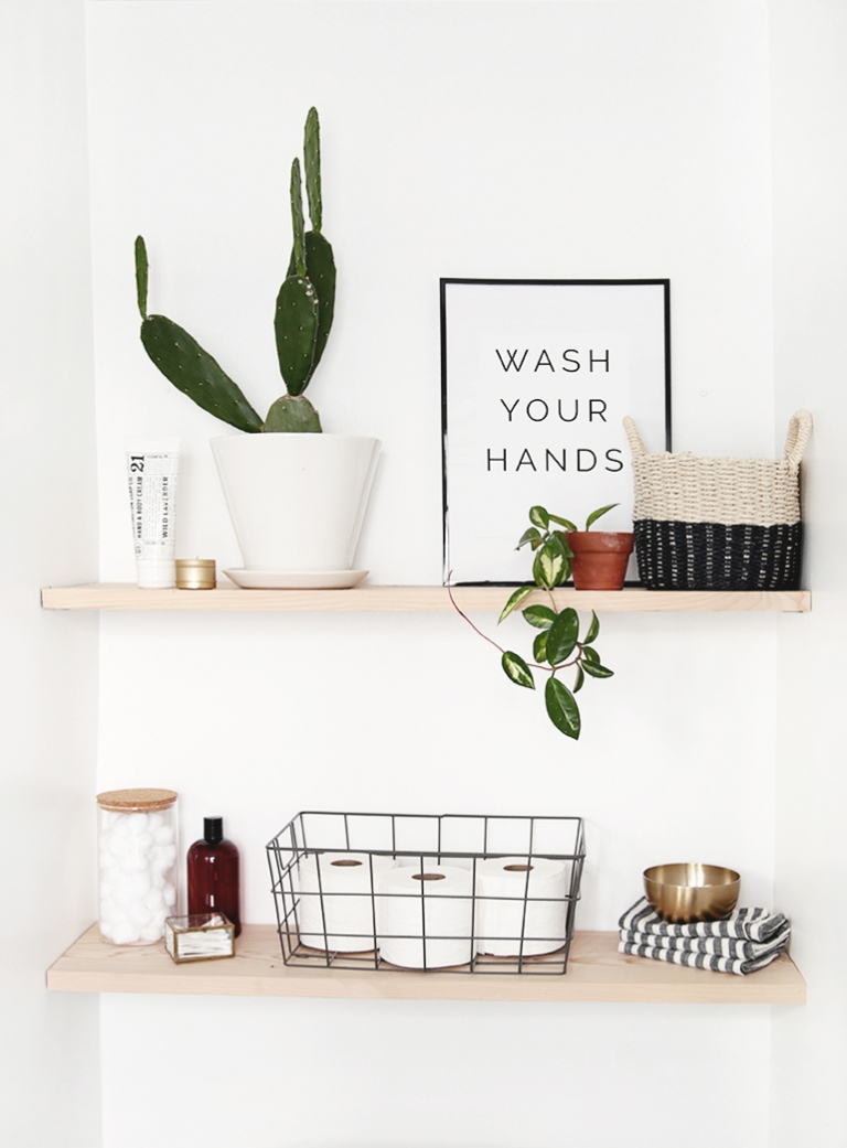 items on wood bathroom shelves