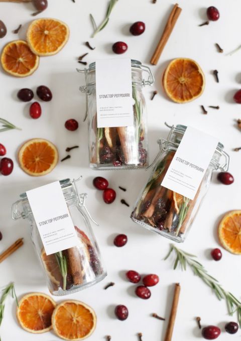 jars of potpourri laying on top of potpourri ingredients