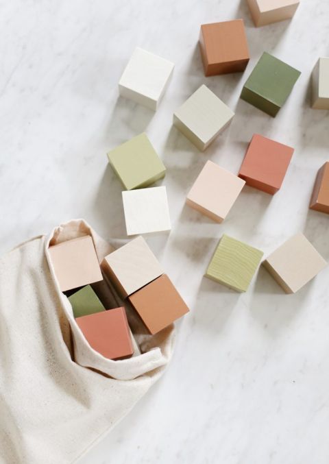 close up of diy wooden blocks spilling out of cotton bag