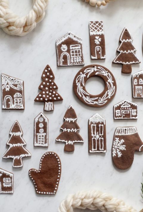gingerbread cutouts with white designs on them