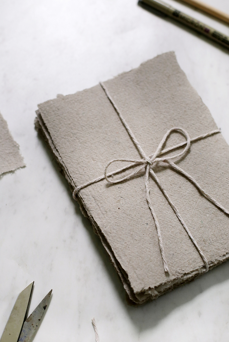 stack of recycled paper tied up with twine