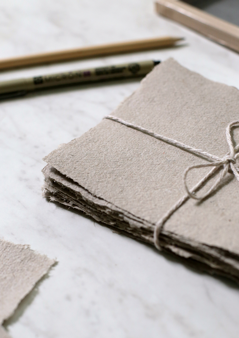 corner or stack of recycled paper tied with twine