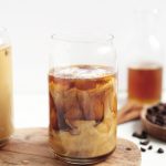 glass of iced coffee swirled with milk