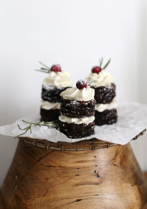 three mini cakes on top of confection stand