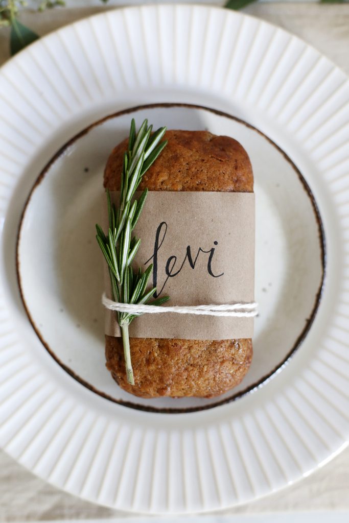 mini banana bread loaf on cream plates