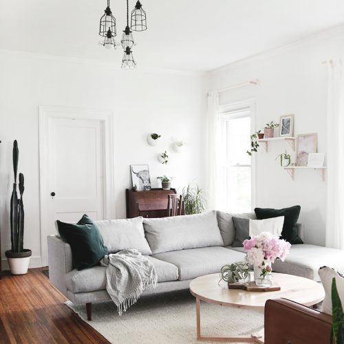 gray sectional couch with round coffee table