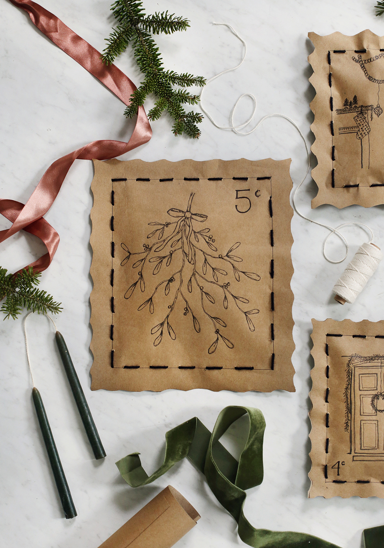 hand drawn mistletoe on hand stitched christmas gift wrapping