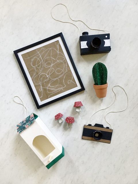 recycled kids crafts laid out on white counter