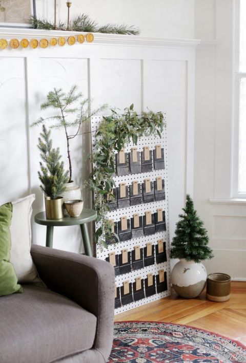 pegboard advent calendar in living room with Christmas decor