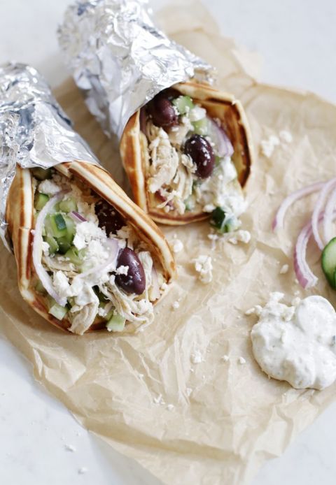 two chicken gyros on parchment paper