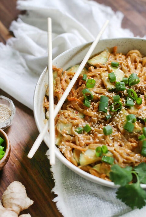 close up of trencher of noodles with chopsticks