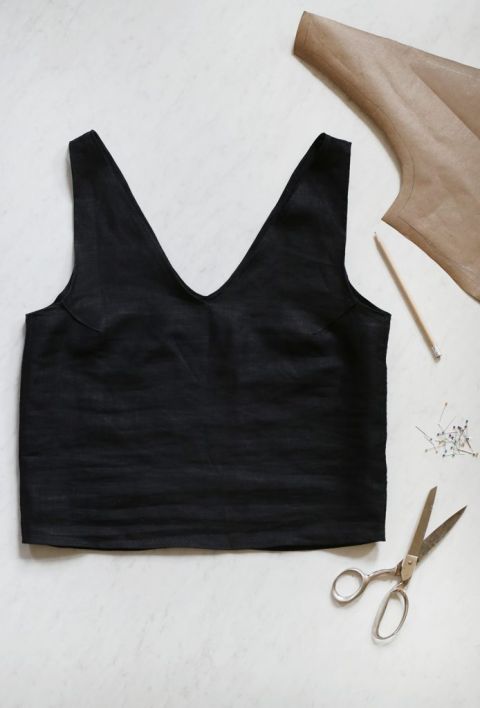 black linen tank with sewing supplies around it