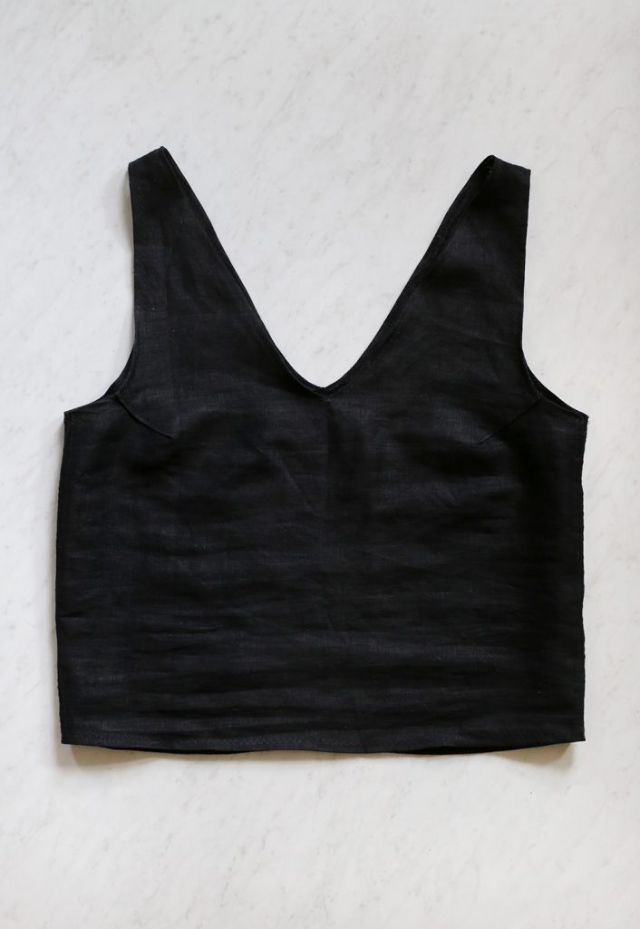 black linen tank laying on floor