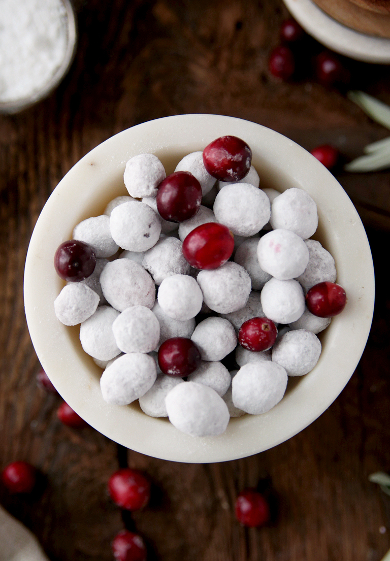 white marble bowl filled with candied cranberries and regular cranberries