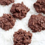 chocolate coconut clusters sitting on shredded coconut