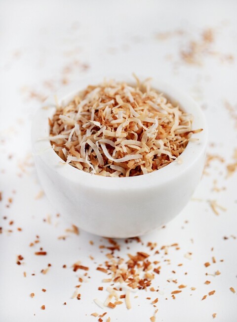 marble bowl filled with toasted coconut